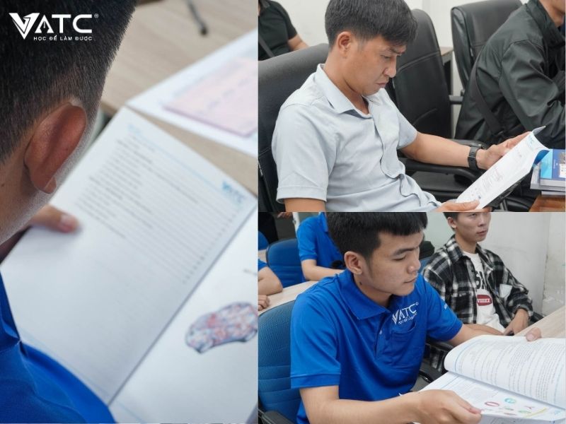 anh em học viên chăm chú đọc tài liệu trước buổi học đầu tiên
